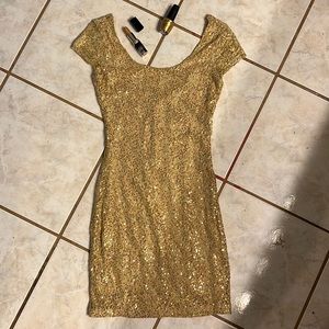 Charlotte Russ Gold sequin party dress. Gold lipstick. Gold nail Polish